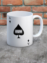Load image into Gallery viewer, David Shrigley Boxed Mug - Fucking Ace | £10.00. White ceramic mug with Artwork by David Shrigley. The design is that of a simple Ace of Spades playing card. Inside the central black leaf is the wording &quot;FUCKING ACE MUG&quot;.. The illustrated gift box in yellow and white is seen in the background.
