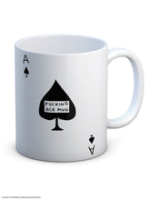 Load image into Gallery viewer, David Shrigley Boxed Mug - Fucking Ace | £10.00. White ceramic mug with Artwork by David Shrigley. The design is that of a simple Ace of Spades playing card. Inside the central black leaf is the wording &quot;FUCKING ACE MUG&quot;.. The illustrated gift box in yellow and white is seen in the background.
