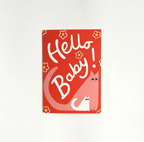 Illustration of pink cat and white kitten on a red background with flowers, with the words “ Hello Baby!”