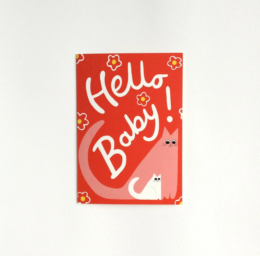 Illustration of pink cat and white kitten on a red background with flowers, with the words “ Hello Baby!”