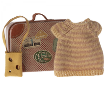 Load image into Gallery viewer, A sweet little metal suitcase illustrated to look like an old vintage one with destination stickers.  The knitted dress insied is soft pink and yellow stripes.  the little habdbag is a natural sand colour with little holes in it like a dutch cheese.
