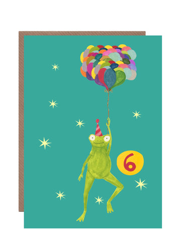 This 6th birthday card by Hutch Cassidy featured a smiling frog in a striped party hat being held aloft by a large bunch of multicoloured balloons he is holding.  The background is bright turquoise and the number 6 is prominently seen in a large yellow circle 