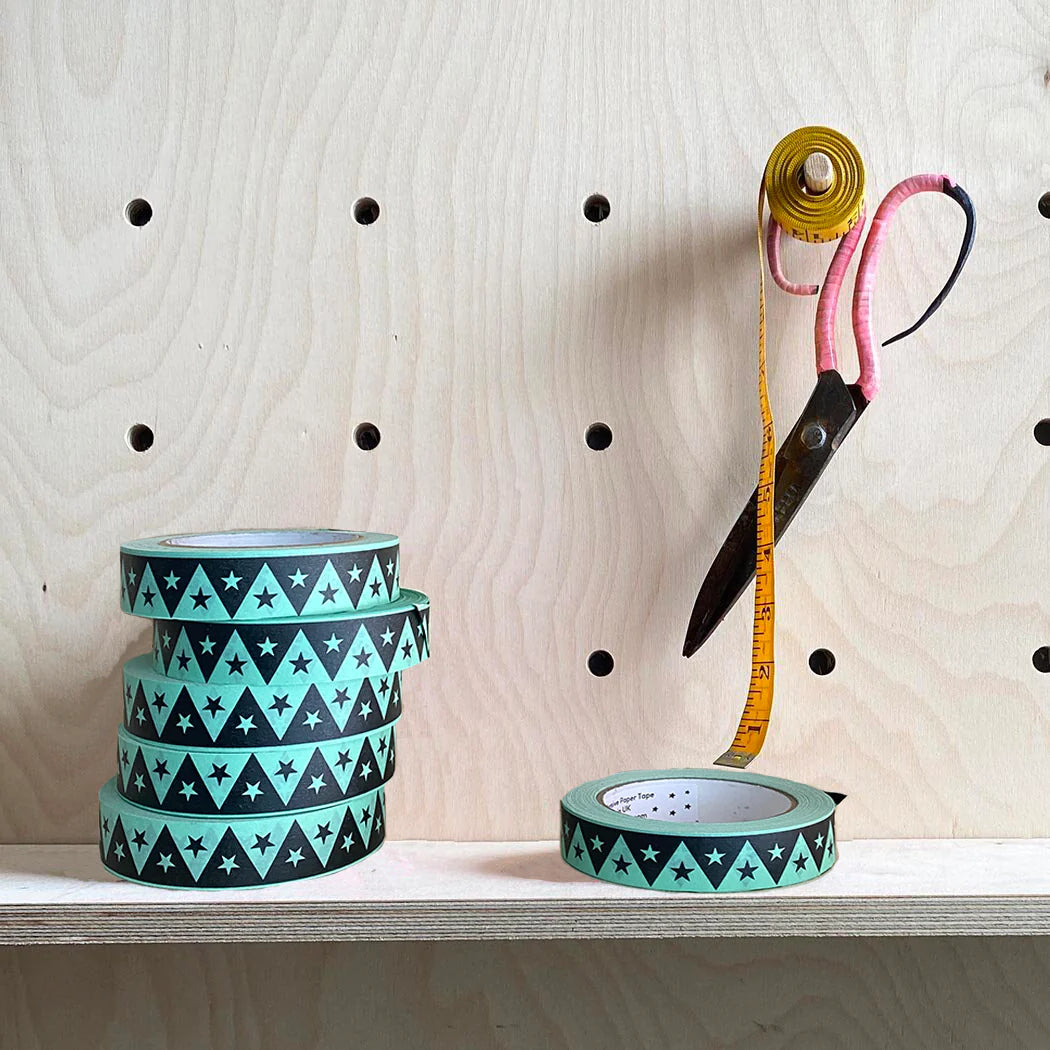 Bright mint coloured paper tape with a design of black triangles and stars.  Fits on standard sellotape dispenser.