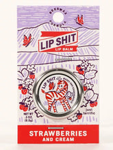 Load image into Gallery viewer, Strawberry and Cream Lip S**t by Blue Q | £7.50. All natural, vitamin E fortified lip balm. The lip balm is contained within a round metal tin with a sticker on the front depicting a cute little zebra.
