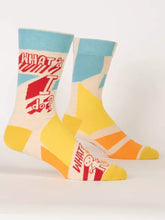 Load image into Gallery viewer, Wha’d I Do? Men’s crew Socks by Blue Q | £11.95. Ethical and sustainable socks with quirky, humorous designs and vibrant colours. The sock features abstract shapes in yellow and blue, and a little stick man with the words “Wha’d I Do?” above. 
