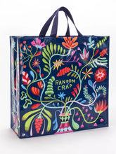 Load image into Gallery viewer, Random Crap Shopper Bag by Blue Q | £11.95. Made of 95% recycled materials which is water resistant and wipeable. This practical and roomy shoulder bag by Blue Q is a nice dark navy with a vibrant coloured design in bright colours depicting a striped. vase with bright, exotic flowers. The words “Random Crap” in green are in the middle of the design. The design is on both sides of the bag. There are short handles and long handles made of black webbing.
