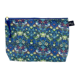 Matte waterproof wash bag. In blue and green straberry thief print 