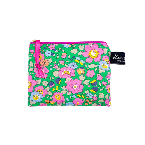 Small fabric purse in Liberty print Betsy Meadow. Bright green background with pink and blue flowers.