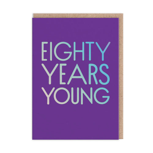 Bright purple card with silver holographic capital lettering “EIGHTY YEARS YOUNG”