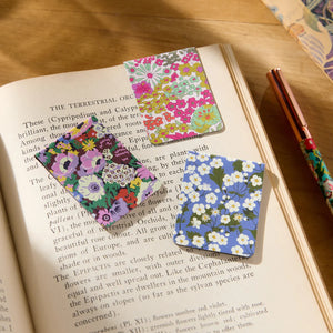 Book marks can be seen lying on the open pages of a book, with one marking the page.