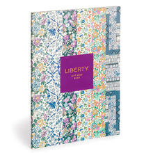 Load image into Gallery viewer, The book of gift wrap front cover which shows the six different designs in vertical strips. A purple rectangle in the centre has gold lettering “LIBERTY GIFT WRAP BOOK”.
