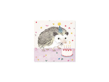 Load image into Gallery viewer, The front of the pop up card featuring a hedgehog wearing a sparkly party hat with a birthday cake with candles and raspberries on top
