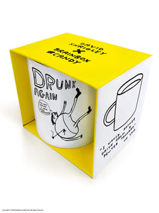 David Shrigley Boxed Mug - Drunk Again | £10.00. White ceramic mug with artwork by David Shrigley. The words "drunk again" appear above a line drawing of a rotund figure with skinny legs lying on the ground with their legs up in the air. The figure has an arrow sticking into his back. A speech bubble reads "I'm not drunk. I have been Harpooned"