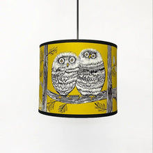 Load image into Gallery viewer, hanging lampshaed with mustard background and a design in black and white featuring baby owls on branches.  There is a black trim to the top and bottom of the shade.
