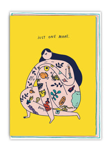 On a bright yellow background is an illustration of a woman with long black hair covered in playful tattoos. The card reads 'just one more'