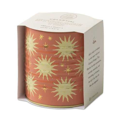 decorative storage tin or pen pot with a sun and star design on a terracotta orange backgound