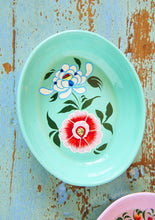 Load image into Gallery viewer, Mint green enamel oval shallo bowl with floral design on a rustic wooden surface
