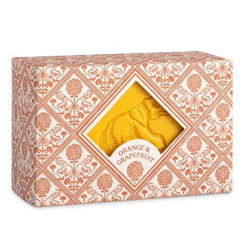 the packaging of the soap has a, soft pink,  tile design with elephants and flowers.  in the centre of the box is a diamons shape cut out through which the yellow soap can be seen with its embossesd elephant design