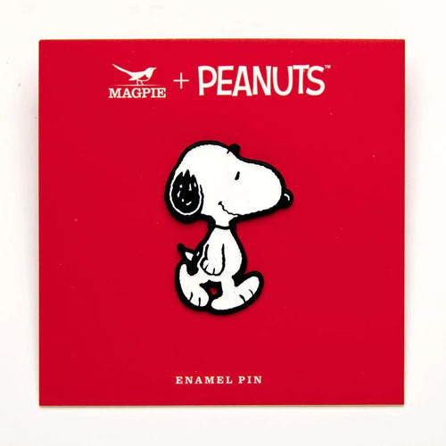 The front of the snoopy pin on the red design backing card