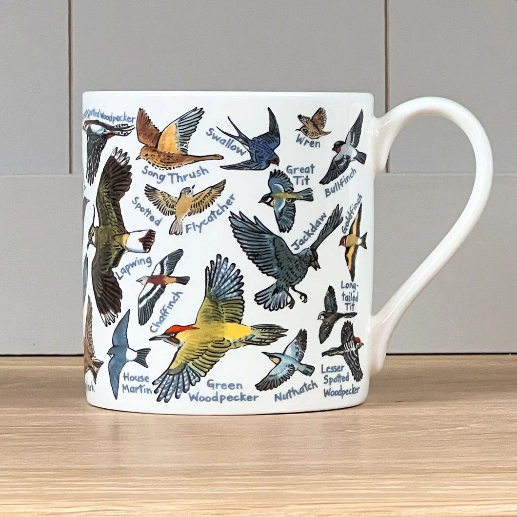 Illustrations of different British birds span the whole of the mug.