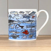 Load image into Gallery viewer, Illustrations of different ocean life span the whole of the mug with placement relevant to how deep they live within the sea.
