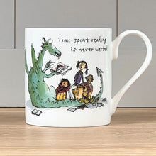 Load image into Gallery viewer, The front of the mug features Quentin Blake&#39;s illustration of a dragon reading to children with the words &quot;Time spent reading is never wasted&quot;.
