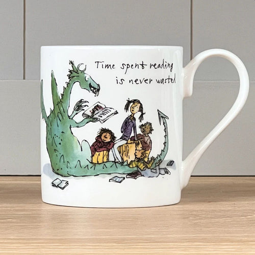 The front of the mug features Quentin Blake's illustration of a dragon reading to children with the words 