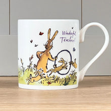Load image into Gallery viewer, The front of the mug features a Quentin Blake illustration of a hare teaching young hares to jump through hoops.
