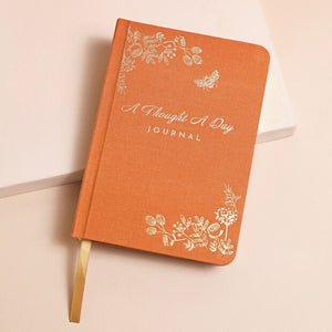The cover of the a thought a day journal 