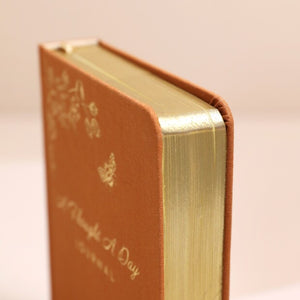 The gold edge of the journal