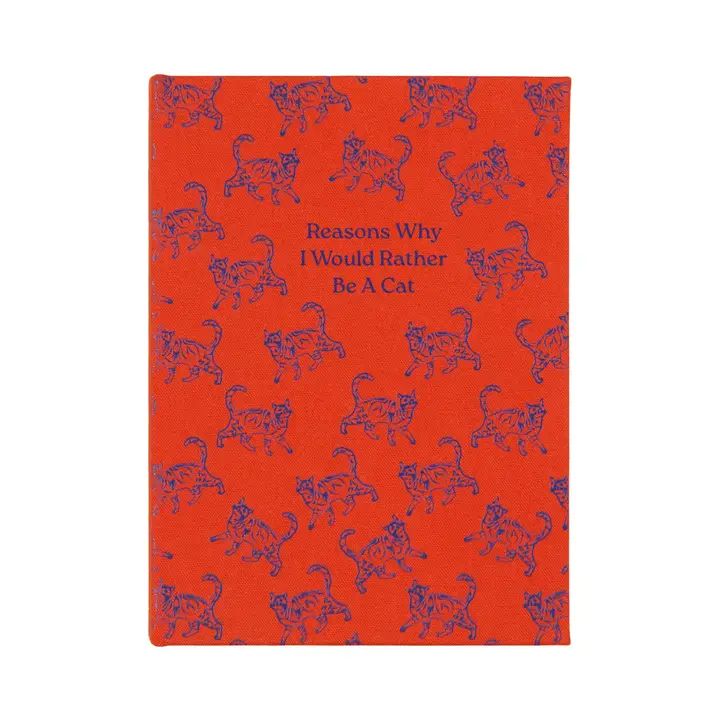 the cover of the notebook ihas a bright red background with a repeating pattern of cats walking in different directions in blue.  it has a title which reads 