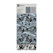 Load image into Gallery viewer, one tea towel has a light blue background while the other has a white background.  Bothe have an over all pattern of the sea and swallows in black
