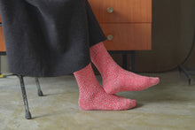 Load image into Gallery viewer, A close up of someone&#39;s feet wearing boot socks in a red and white flecked colourway
