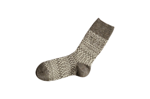 A grey and white jacquard weave sock on a blank backround