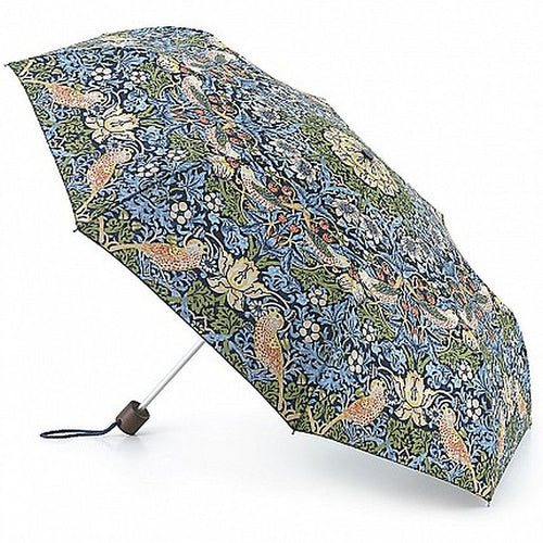 The umbrella is open and the beautiful strawberry thief design with birds and strawberries and strawberry plants coveringbit. The background is dark blue and the design is in greens, blues reds and yellows