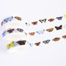 Load image into Gallery viewer, British Butterflies Washi Tape.  realistically illustrated variety of different british butterflied running along the paper tape,  including chalkhill blue, red amiral, brimstone, comma, green veined white, peacock, marbled white, purple emporer and painted lady.
