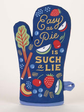 Load image into Gallery viewer, Nevy blue oven glove with the Words Easy as Pie in an elegant scroll font and then in bigger capital letters IS SUCH A LIE.  The text is surrounded by illustrations of various fruit and vegetables, including strawberries, apples and a leafy green.
