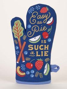 Nevy blue oven glove with the Words Easy as Pie in an elegant scroll font and then in bigger capital letters IS SUCH A LIE.  The text is surrounded by illustrations of various fruit and vegetables, including strawberries, apples and a leafy green.