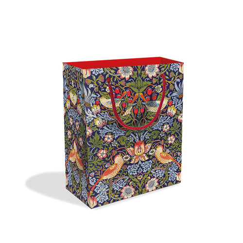 Gift bage with william morris strawberry thief design.  The background is dark navy, while the plants, berries and birds are depicted in soft green, blue, cream and red.