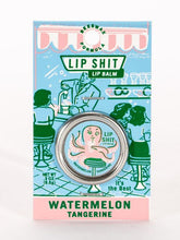 Load image into Gallery viewer, Watermelon &amp; Tangerine Lip S**t by Blue Q | £7.50. All natural, vitamin E fortified lip balm. The lip balm is contained within a round metal tin with a sticker on the front depicting a pink octopus sipping from a cup using a straw with the words “Lip Shit” above. 
