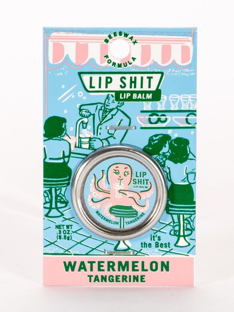 Watermelon & Tangerine Lip S**t by Blue Q | £7.50. All natural, vitamin E fortified lip balm. The lip balm is contained within a round metal tin with a sticker on the front depicting a pink octopus sipping from a cup using a straw with the words “Lip Shit” above. 