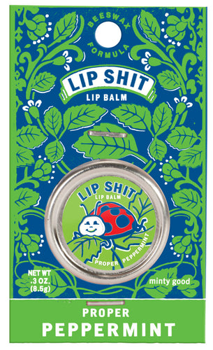 Proper Peppermint Lip S**t by Blue Q | £7.50. All natural, vitamin E fortified lip balm. The lip balm is contained within a round metal tin with a sticker on the front depicting a ladybird smiling with the words “Lip Shit” above. 