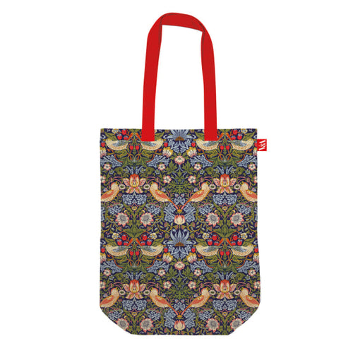 Cotton tote bag with red straps and the bag featuring the strawberry thief design by William Morris.  The design repeats twice down the bag and accross.  It has a dark navy background with the plants, birds, flowers and berries in blue, greens, soft orange and red.